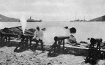 Firing time-gun battery on waterfront, Charlotte Amalia